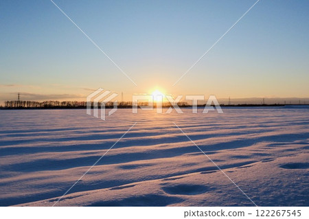 Sunset and snowy fields "Snow covering the fields" 122267545