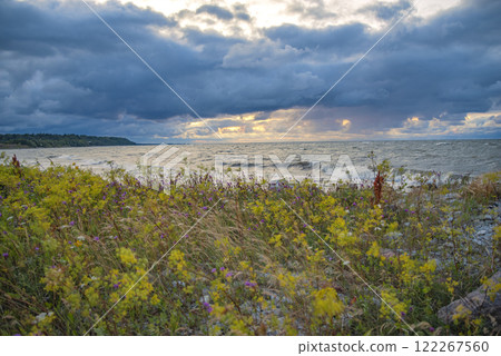 Sunset on the sea coast. 122267560