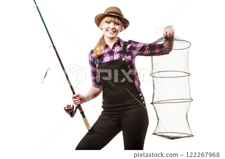 Happy woman holding fishing rod and keepnet Happy woman holding fishing rod and keepnet 122267968