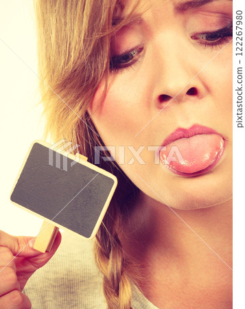 Teenage girl holding little school blackboards Teenage girl holding little school blackboards 122267980