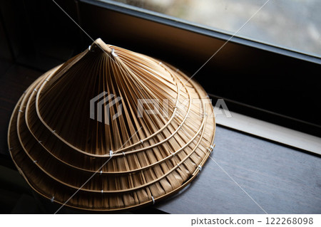 A hat by the window A hat by the window 122268098