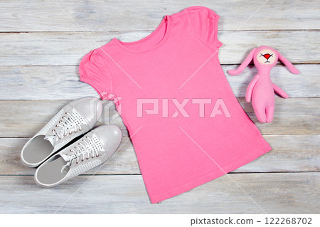 Pink T-Shirt Mockup on Wooden Background Pink T-Shirt Mockup on Wooden Background 122268702