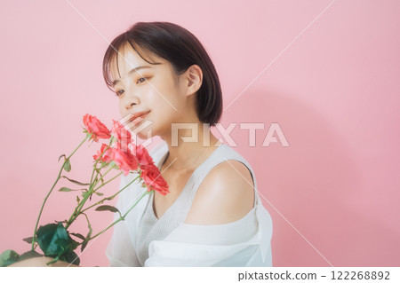 A young woman with flowers 122268892