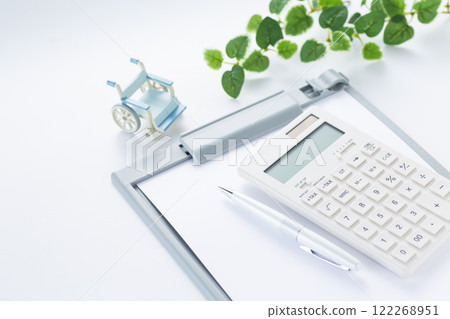 Calculator, binder and wheelchair 122268951