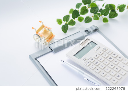 Calculator, binder and wheelchair 122268976