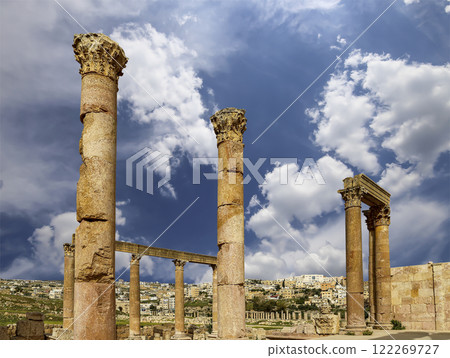 Roman ruins (against the background of a beautiful sky with clouds) in the Jordanian city of Jerash (Gerasa of Antiquity), capital and largest city of Jerash Governorate, Jordan Roman ruins (against the background of a beautiful sky with clouds) in the Jordanian city of Jerash (Gerasa of Antiquity), capital and largest city of Jerash Governorate, Jordan 122269727