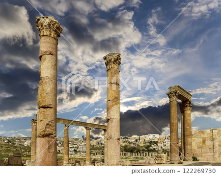 Roman ruins (against the background of a beautiful sky with clouds) in the Jordanian city of Jerash (Gerasa of Antiquity), capital and largest city of Jerash Governorate, Jordan Roman ruins (against the background of a beautiful sky with clouds) in the Jordanian city of Jerash (Gerasa of Antiquity), capital and largest city of Jerash Governorate, Jordan 122269730