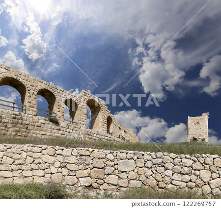 Roman ruins (against the background of a beautiful sky with clouds) in the Jordanian city of Jerash (Gerasa of Antiquity), capital and largest city of Jerash Governorate, Jordan Roman ruins (against the background of a beautiful sky with clouds) in the Jordanian city of Jerash (Gerasa of Antiquity), capital and largest city of Jerash Governorate, Jordan 122269757