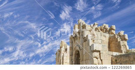 Roman ruins (against the background of a beautiful sky with clouds) in the Jordanian city of Jerash (Gerasa of Antiquity), capital and largest city of Jerash Governorate, Jordan Roman ruins (against the background of a beautiful sky with clouds) in the Jordanian city of Jerash (Gerasa of Antiquity), capital and largest city of Jerash Governorate, Jordan 122269865