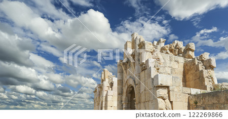 Roman ruins (against the background of a beautiful sky with clouds) in the Jordanian city of Jerash (Gerasa of Antiquity), capital and largest city of Jerash Governorate, Jordan Roman ruins (against the background of a beautiful sky with clouds) in the Jordanian city of Jerash (Gerasa of Antiquity), capital and largest city of Jerash Governorate, Jordan 122269866