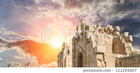 Roman ruins (against the background of a beautiful sky with clouds) in the Jordanian city of Jerash (Gerasa of Antiquity), capital and largest city of Jerash Governorate, Jordan Roman ruins (against the background of a beautiful sky with clouds) in the Jordanian city of Jerash (Gerasa of Antiquity), capital and largest city of Jerash Governorate, Jordan 122269867