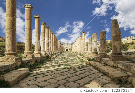 Roman Columns in the Jordanian city of Jerash (Gerasa of Antiquity), capital and largest city of Jerash Governorate, Jordan. Against the background of a beautiful sky with clouds Roman Columns in the Jordanian city of Jerash (Gerasa of Antiquity), capital and largest city of Jerash Governorate, Jordan. Against the background of a beautiful sky with clouds 122270134