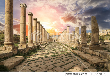 Roman Columns in the Jordanian city of Jerash (Gerasa of Antiquity), capital and largest city of Jerash Governorate, Jordan. Against the background of a beautiful sky with clouds Roman Columns in the Jordanian city of Jerash (Gerasa of Antiquity), capital and largest city of Jerash Governorate, Jordan. Against the background of a beautiful sky with clouds 122270139