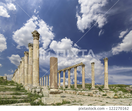 Roman Columns in the Jordanian city of Jerash (Gerasa of Antiquity), capital and largest city of Jerash Governorate, Jordan. Against the background of a beautiful sky with clouds 122270162