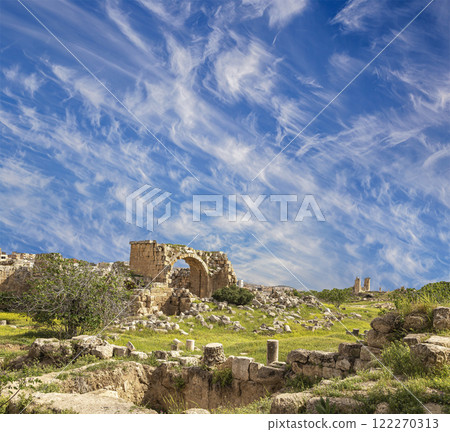Roman ruins (against the background of a beautiful sky with clouds) in the Jordanian city of Jerash (Gerasa of Antiquity), capital and largest city of Jerash Governorate, Jordan Roman ruins (against the background of a beautiful sky with clouds) in the Jordanian city of Jerash (Gerasa of Antiquity), capital and largest city of Jerash Governorate, Jordan 122270313
