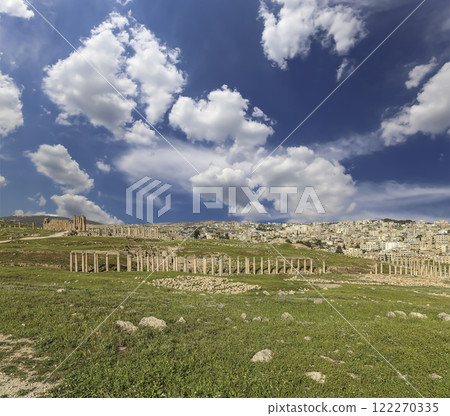 Roman ruins (against the background of a beautiful sky with clouds) in the Jordanian city of Jerash (Gerasa of Antiquity), capital and largest city of Jerash Governorate, Jordan 122270335