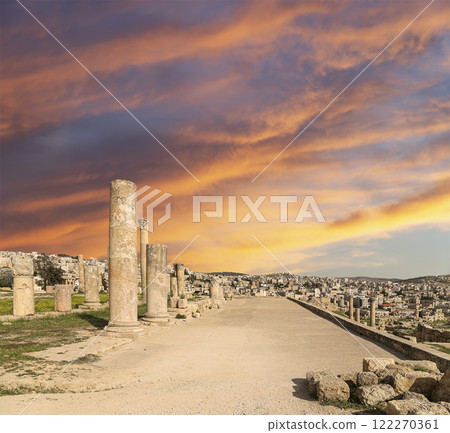 Roman ruins (against the background of a beautiful sky with clouds) in the Jordanian city of Jerash (Gerasa of Antiquity), capital and largest city of Jerash Governorate, Jordan Roman ruins (against the background of a beautiful sky with clouds) in the Jordanian city of Jerash (Gerasa of Antiquity), capital and largest city of Jerash Governorate, Jordan 122270361