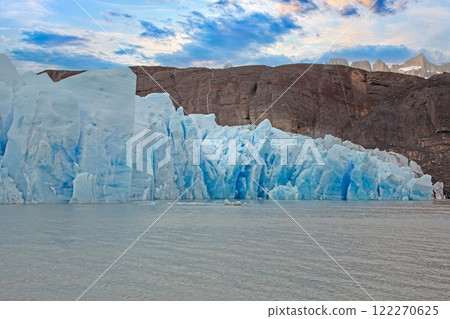 Closeup of Grey Glaciers calving front with icy peaks and reflections in Torres del Paine National Park 122270625