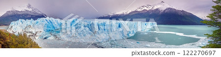 Perito Moreno Glacier with its dramatic icy wall and surrounding snowy mountains in Patagonia 122270697