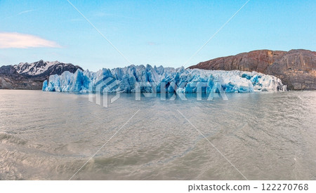 Closeup of Grey Glaciers calving front with icy peaks and reflections in Torres del Paine National Park 122270768