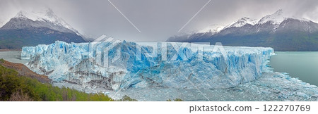 Perito Moreno Glacier with its dramatic icy wall and surrounding snowy mountains in Patagonia 122270769