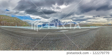 View from the far end of Lago Grey with icebergs and dramatic mountain backdrop in Torres del Paine 122270770