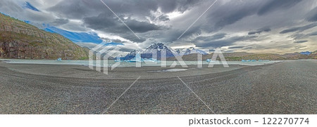 View from the far end of Lago Grey with icebergs and dramatic mountain backdrop in Torres del Paine 122270774