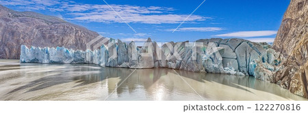 Closeup of Grey Glaciers calving front with icy peaks and reflections in Torres del Paine National Park 122270816