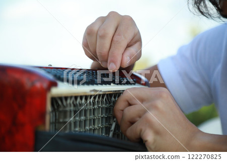Metal Parts Of The Accordion During Tuning  122270825