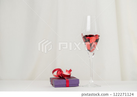 Minimalist Wine Glass and Gift box on cream Background 122271124