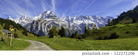 Traditional alpine village in touristic valley Lauterbrunnen, Switzerland attraction 122271206