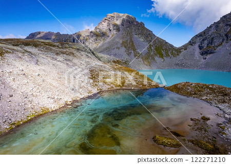 Aerial view of Mountain lake Wildsee on Pizol 5 lakes hike in Switzerland Aerial view of Mountain lake Wildsee on Pizol 5 lakes hike in Switzerland 122271210