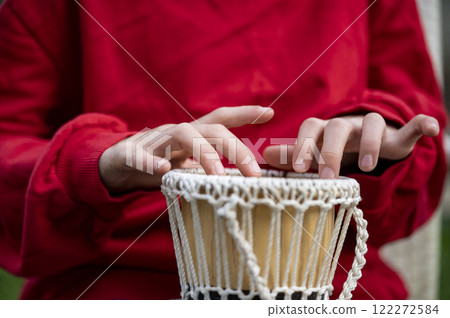 Gentle hands playing a jembe drums Gentle hands playing a jembe drums 122272584