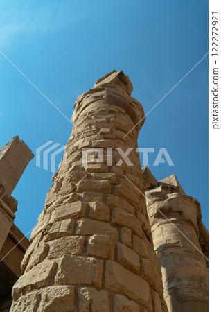Egyptian column with blocks against the sky Egyptian column with blocks against the sky 122272921