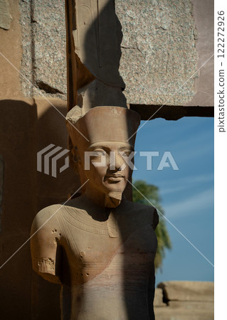 Pharaoh statue near the wall in Luxor 122272926
