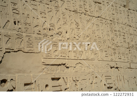 Ancient Egyptian ancient wall with carved hieroglyphs in Luxor Ancient Egyptian ancient wall with carved hieroglyphs in Luxor 122272931