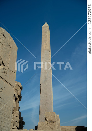 Ancient Egyptian obelisk next to the wall at Karnak Ancient Egyptian obelisk next to the wall at Karnak 122272978