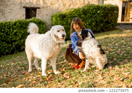 Woman with Dogs in Countryside 122273075