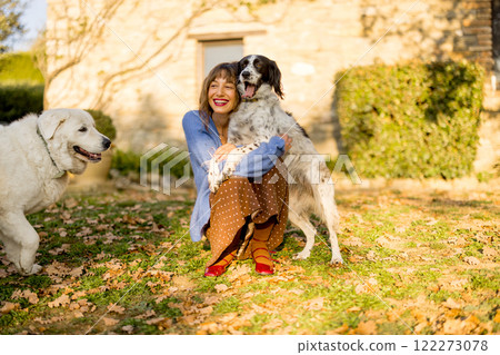 Woman with Dogs in Countryside 122273078