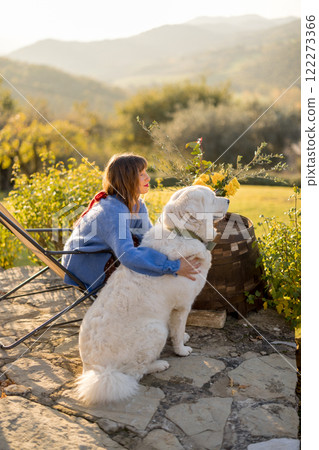 Woman and Dog Enjoying Countryside 122273366