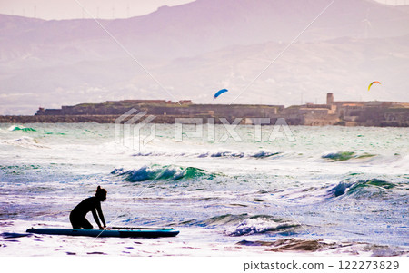 Female learning how to surf 122273829