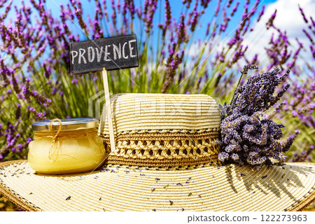 Summer hat and honey at lavender field, Provence France. Summer hat and honey at lavender field, Provence France. 122273963