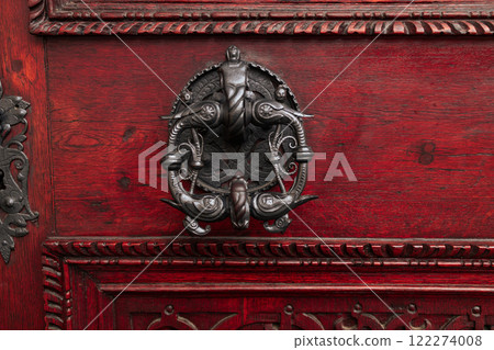 Door lock and door knocker on old red doors in Praha  122274008