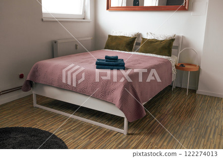 Stylish bedroom interior with comfortable bed and beautiful houseplants Stylish bedroom interior with comfortable bed and beautiful houseplants 122274013