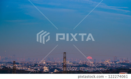 January 14th: The first full wolf moon of the year appears from behind the buildings of the big city. January 14th: The first full wolf moon of the year appears from behind the buildings of the big city. 122274061