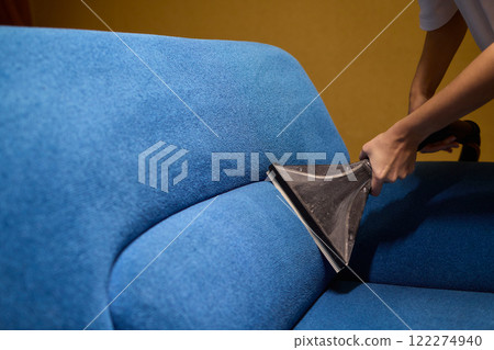 The Upholstery Cleaning Process Effectively Freshening Up a Beautiful Blue Couch 122274940