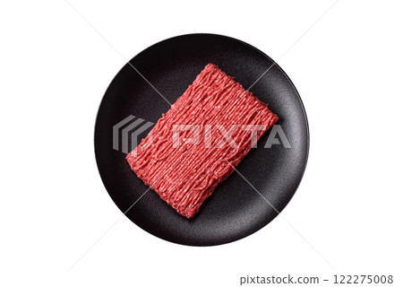 Fresh raw ground beef with salt, spices and herbs 122275008