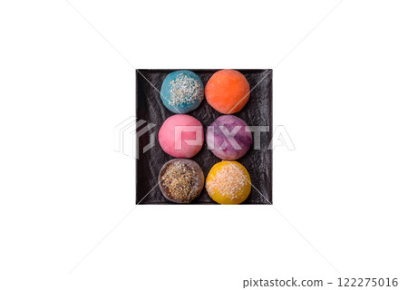 Delicious colorful asian mochi sweets with rice dough shell and fruit filling Delicious colorful asian mochi sweets with rice dough shell and fruit filling 122275016