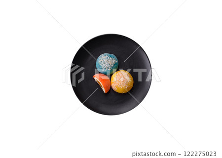 Delicious colorful asian mochi sweets with rice dough shell and fruit filling Delicious colorful asian mochi sweets with rice dough shell and fruit filling 122275023