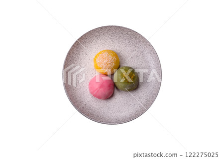 Delicious colorful asian mochi sweets with rice dough shell and fruit filling Delicious colorful asian mochi sweets with rice dough shell and fruit filling 122275025
